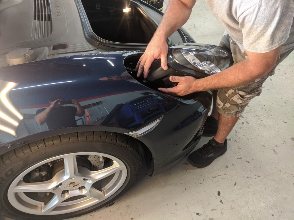 Porsche Boxster Headlight Being Removed
